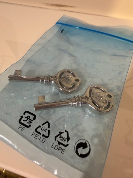 Yamaha, U3S, two silver piano keys in a protective plastic bag